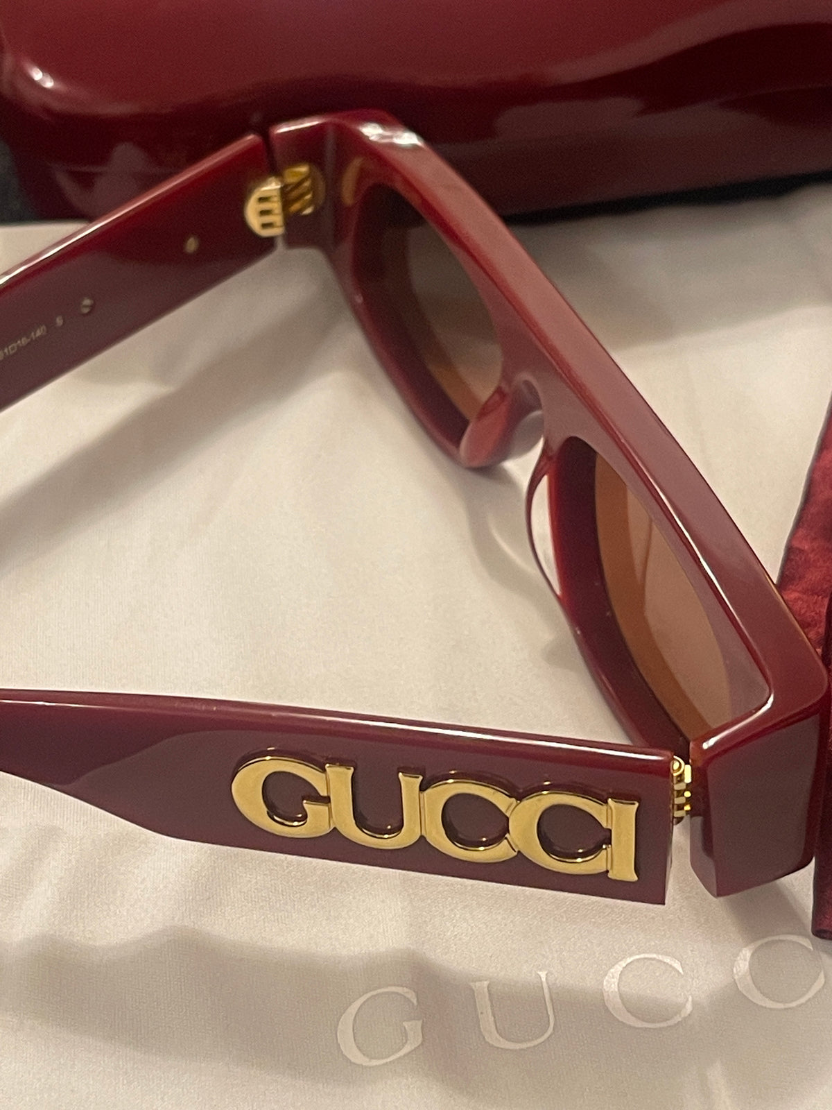 Gucci sunglasses in Ancora red